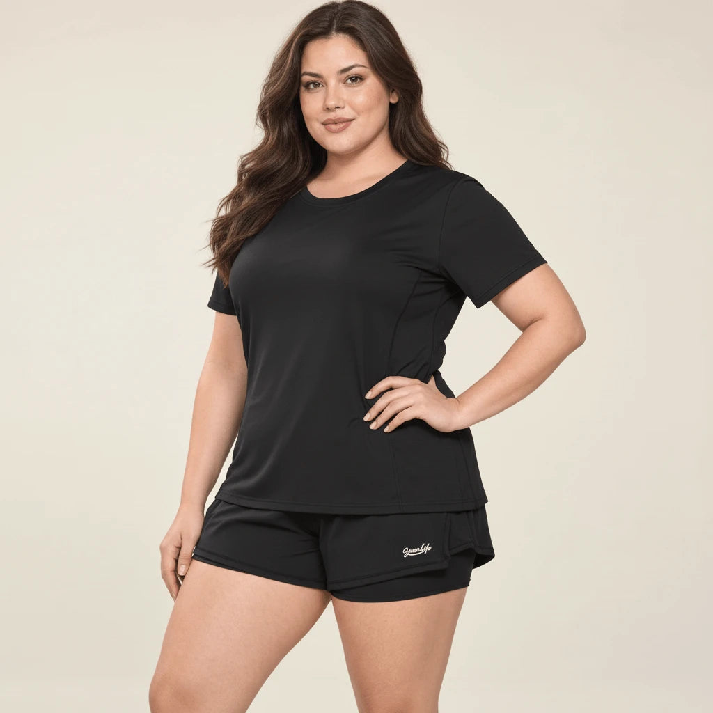 Tee shirt de sport femme grande taille noir porté, silhouette complète de face