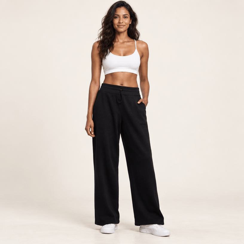 Jogging polaire femme noir taille haute porté de face : quelle taille de jogging femme choisir
