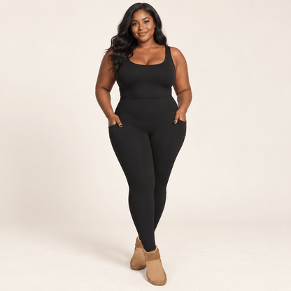Collant polaire grande taille noir porté de face, mains dans les poches latérales, taille haute