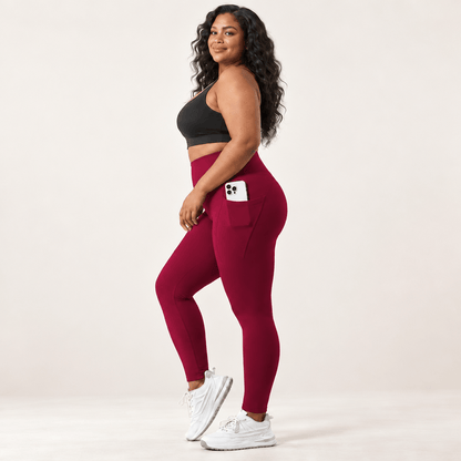Legging randonnée femme grande taille bordeaux de profil, poche latérale profonde