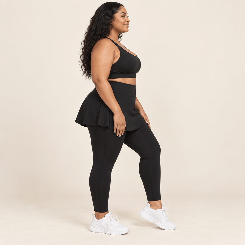 Jupe legging grande taille noire vue de profil, jupe évasée couvrant les hanches