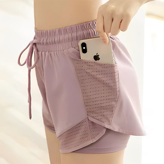 Détail poche short running femme, rangement smartphone anti-rebond course