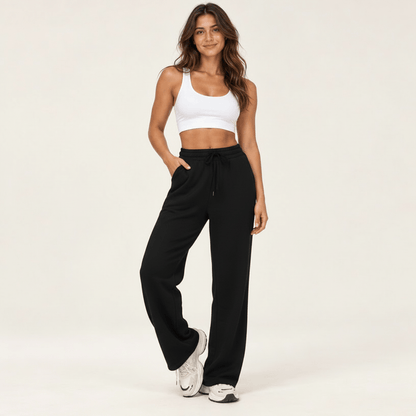 Jogging femme noir à taille haute et jambe large, cordon de serrage et poches latérales