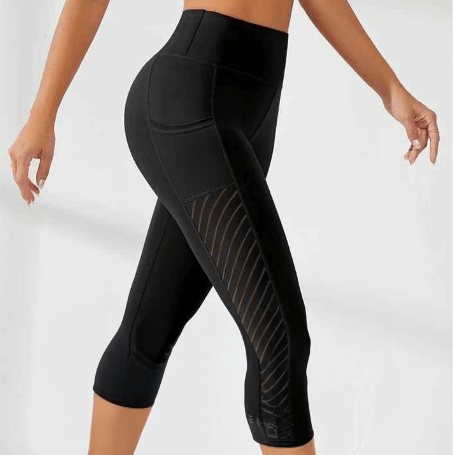 Legging running femme capri noir taille haute avec poches intégrées pour smartphone, longueur trois-quarts sous le mollet