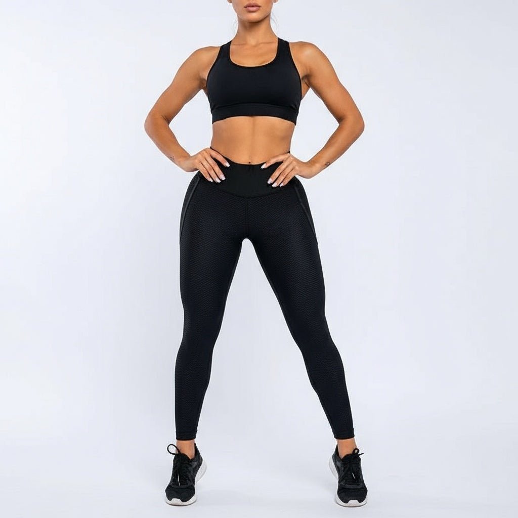 Legging noir power femme avec technologie de compression graduée intelligente pour optimiser la performance sportive.