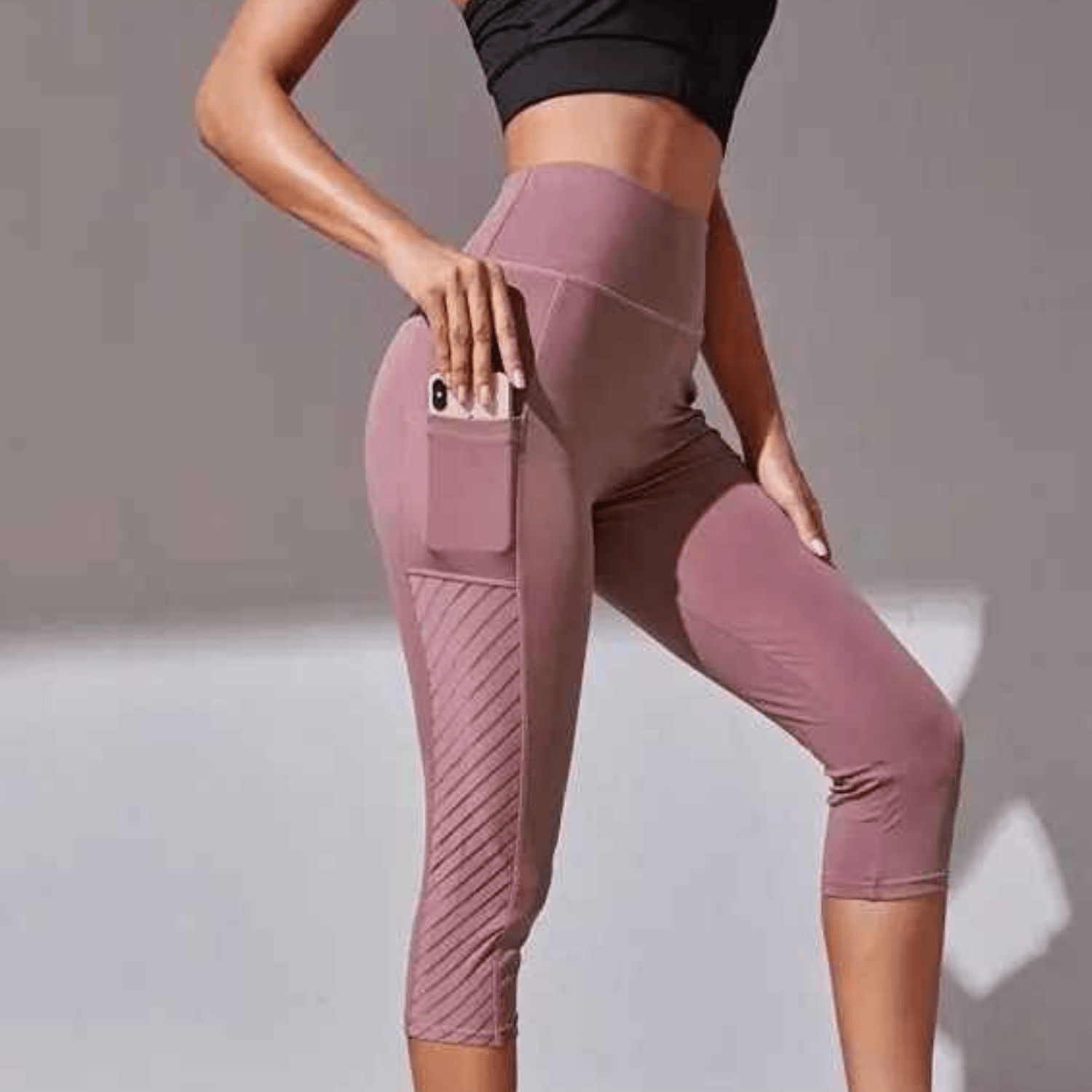 Poches profondes sécurisées du legging running capri femme maintenant smartphone iPhone sans ballotement pendant la course