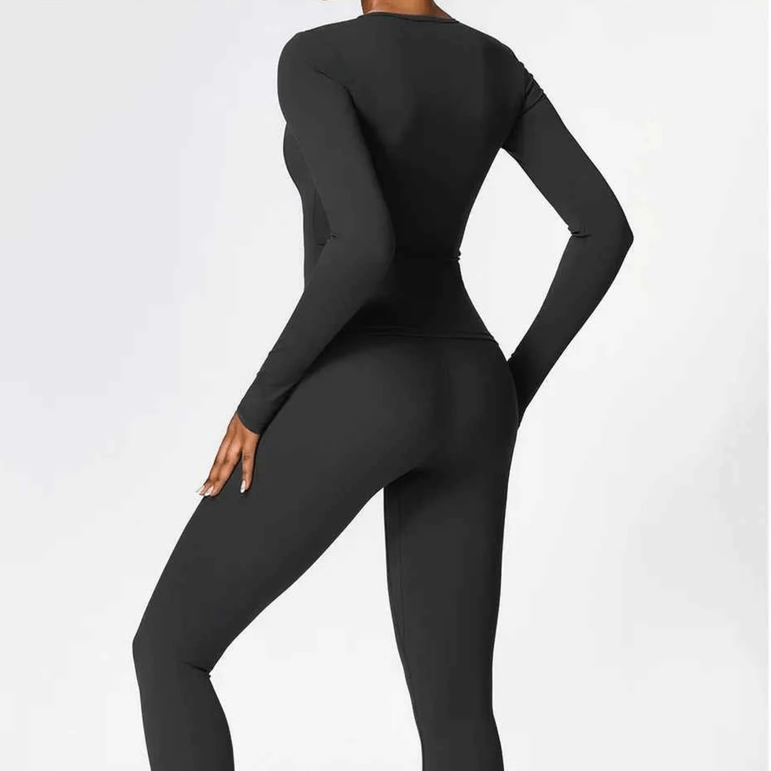 T-shirt de compression sport femme manches longues, design technique seamless pour maintien musculaire