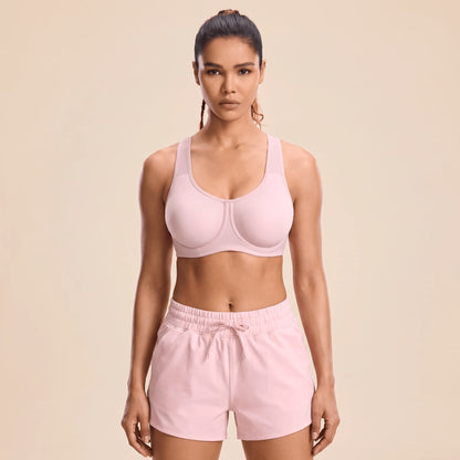Brassière fitness femme à armatures rose poudré, vue de face, bonnets lisses sans couture