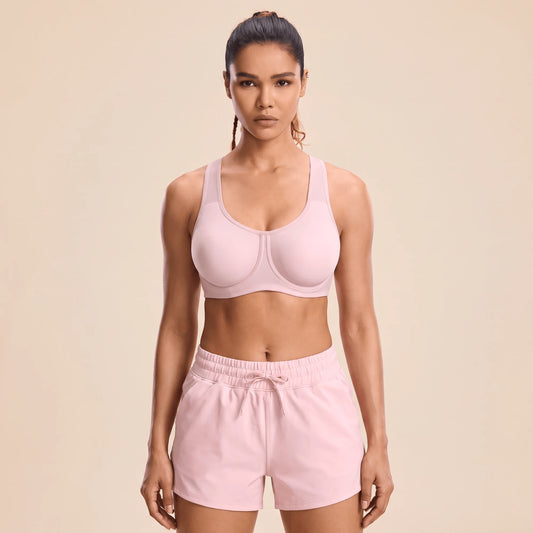 Brassière fitness femme à armatures rose poudré, vue de face, bonnets lisses sans couture