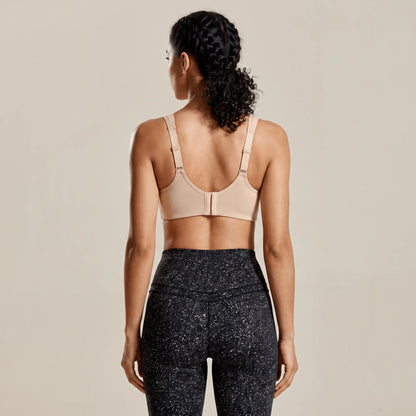 Dos d'une brassière sport réglable beige : bretelles larges avec boucles d'ajustement