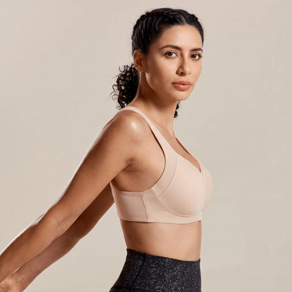 Soutien gorge running beige vu de profil, bonnet structuré et panneaux en maille