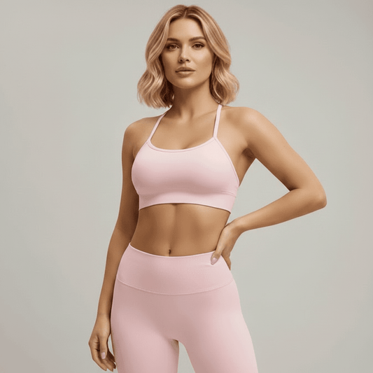 Brassière Sans Couture Femme rose pâle, vue de face, portée en studio minimaliste gris clair.