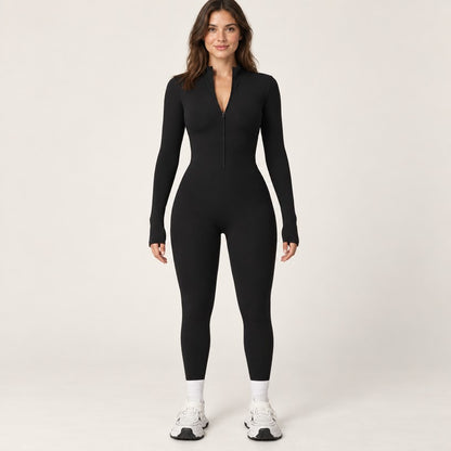 Combinaison polaire femme noire vue de face, col montant zippé et manches à trous pouces