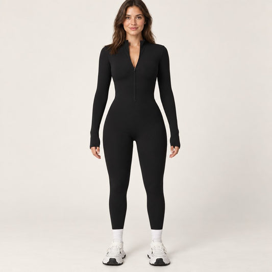 Combinaison polaire femme noire vue de face, col montant zippé et manches à trous pouces