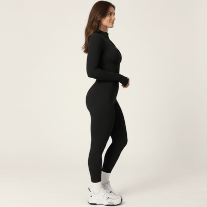 Combinaison polaire femme noire vue de profil, ligne continue des épaules à la cheville
