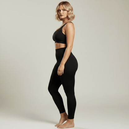 Legging Sculptant Femme Taille Haute noir, vue de profil, studio gris ivoire doux, femme blonde 39 ans