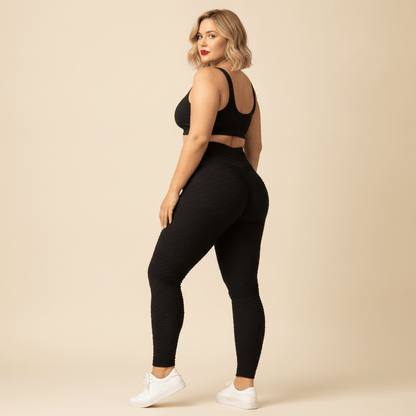 Legging anti-cellulite efficace grande taille noir texturé vu de dos, effet scrunch push-up, femme ronde, studio ivoire