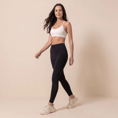 Legging de compression sport femme noir taille haute, en marchant, poches latérales et cordon
