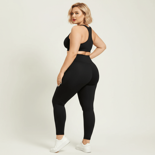 Legging femme grande taille noir uni taille haute poches latérales vue trois quarts dos galbe fessier studio