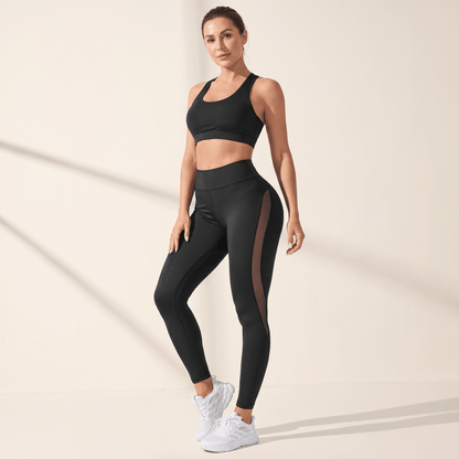 Legging noir femme taille haute, vue de trois quarts, panneau mesh sur le côté de la jambe