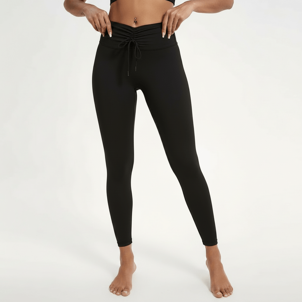Legging femme Positiflow noir, macro tissu lisse compressif, coutures et finition premium, photo textile