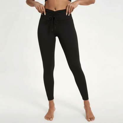 Legging femme Positiflow noir, macro tissu lisse compressif, coutures et finition premium, photo textile