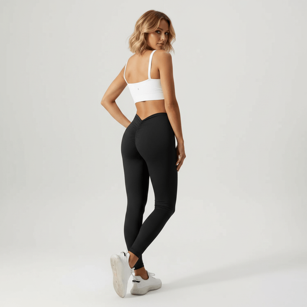 Leggings noir scrunch dos, vue de dos face caméra, pose fashion studio minimaliste