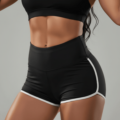 Short femme sport noir liseré blanc, zoom détail taille haute et bordure blanche en studio
