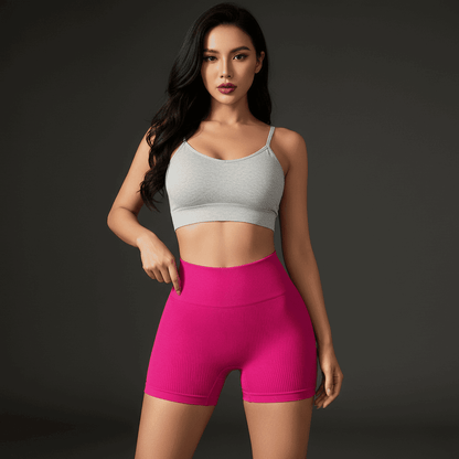 Short taille haute femme rose fuchsia pose élégante vue de face premium
