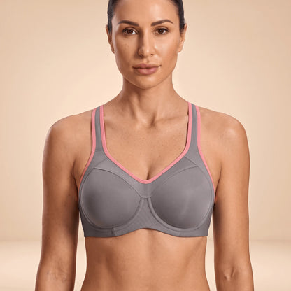 Soutien-gorge de sport gris à armatures et liseré rose, porté de face