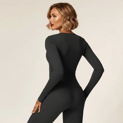 T-shirt compression femme manches longues noir – vue de dos, silhouette gainée, femme blonde carré wavy fond studio ivoire