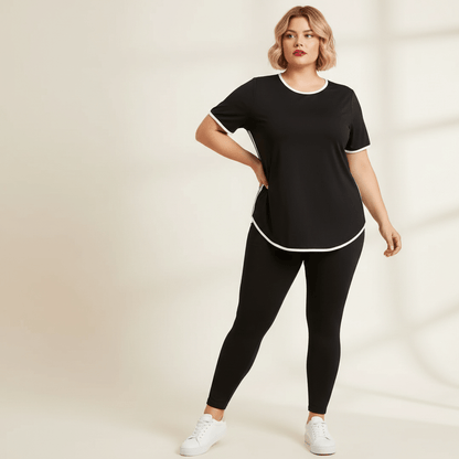 T-shirt de sport femme grande taille noir liserés blancs bandes latérales vue face trois-quarts fond studio crème