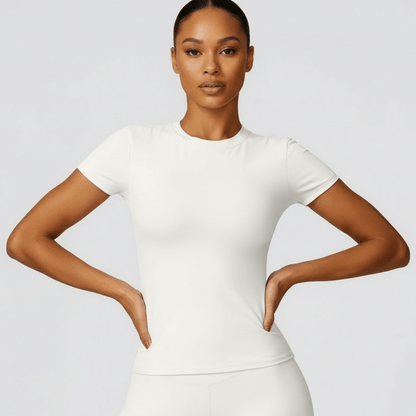 T shirt femme blanc positiflow avec coupe ajustée et design épuré pour le sport et le quotidien.