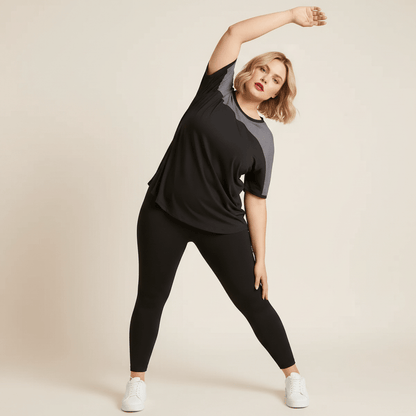 Tee shirt grande taille femme noir mesh gris color-block étirement latéral bras levé fond studio crème