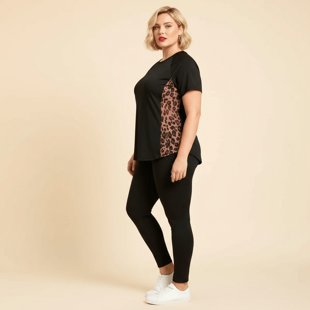 Tshirt sport femme grande taille noir panneau latéral maille léopard vue profil fond studio crème